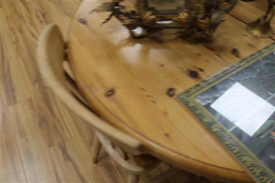 A pine extending dining table and four chairs, W.159cm fully extended with 1 leaf